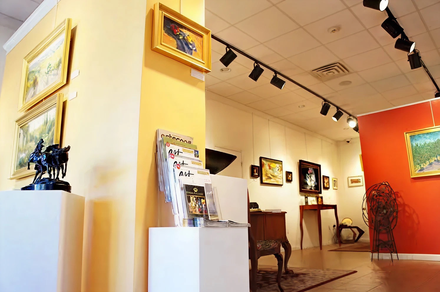 Inside the gallery: paintings and sculpture under track lighting