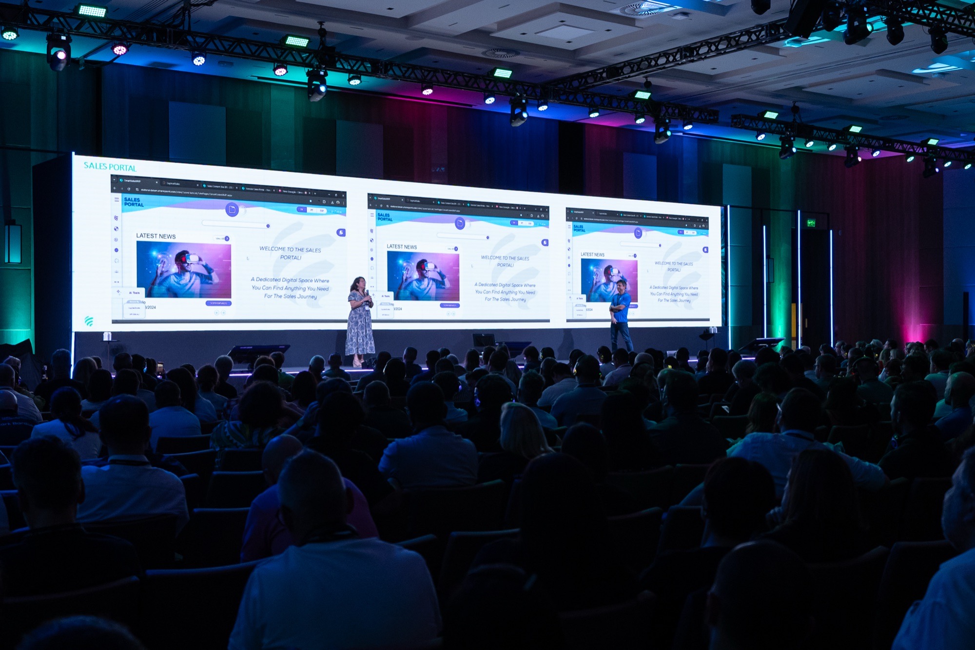 Speaking on stage at a Stefanini event
